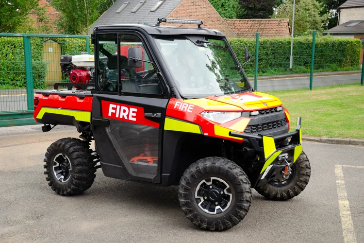 Black polaris vehicle with fire branding on
