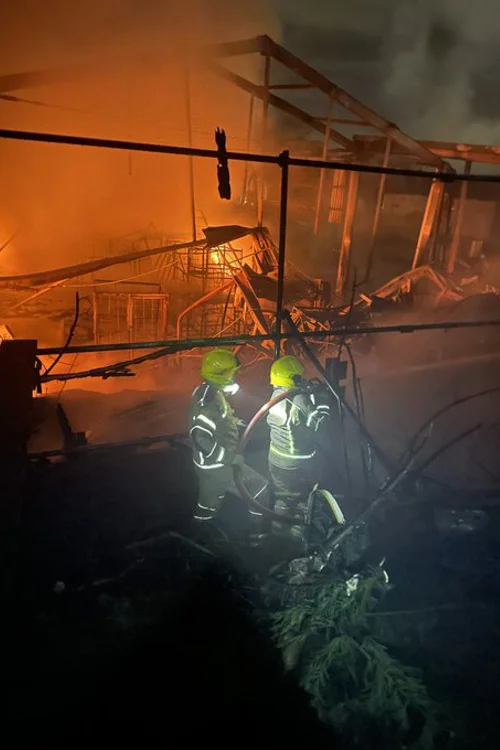 Two Firefighters inside the burning building on Forest Road Mansfield.