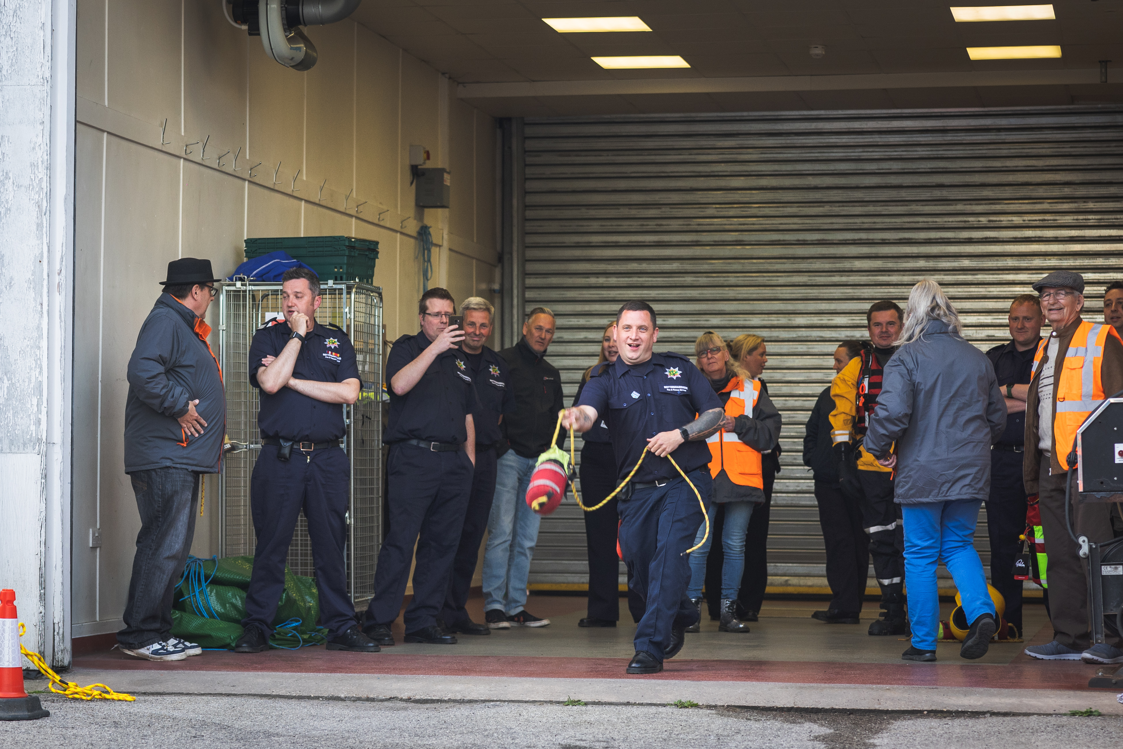 Stapleford Firefighter demonstrating how to use a throw line.