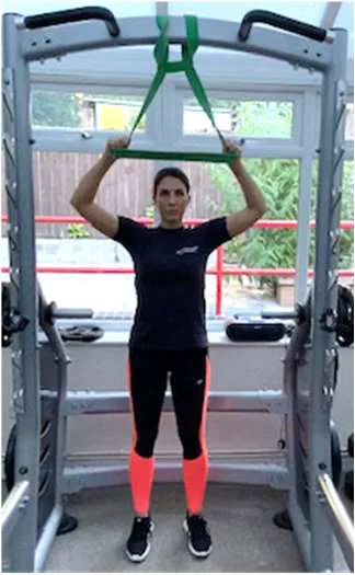 Demonstration of a lat pull down using exercise bands