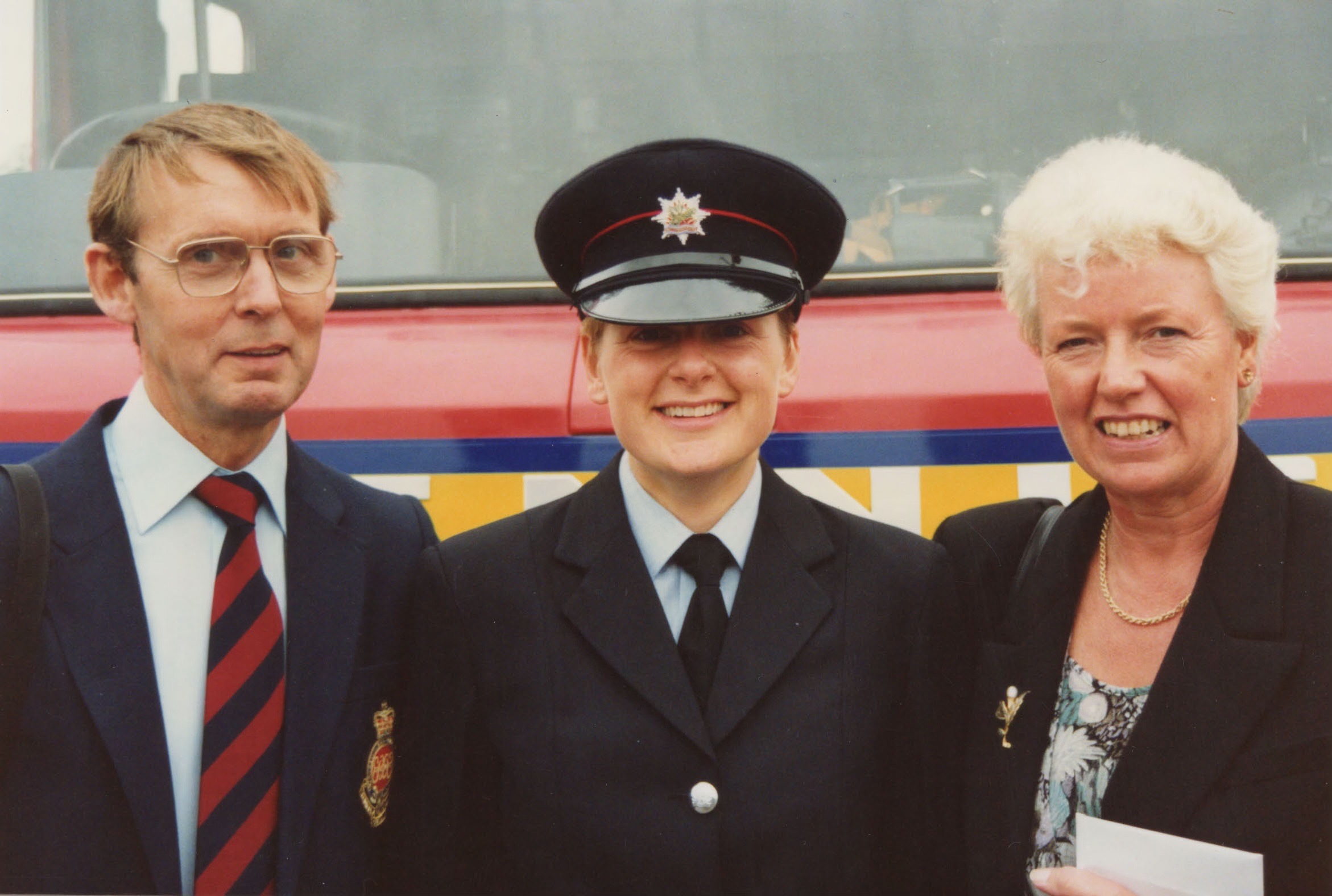 Nottingham's first female firefighter with her parents at the pass out parade