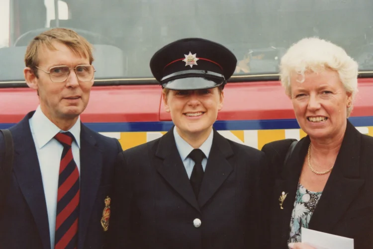 Nottingham's first female firefighter with her parents at the pass out parade
