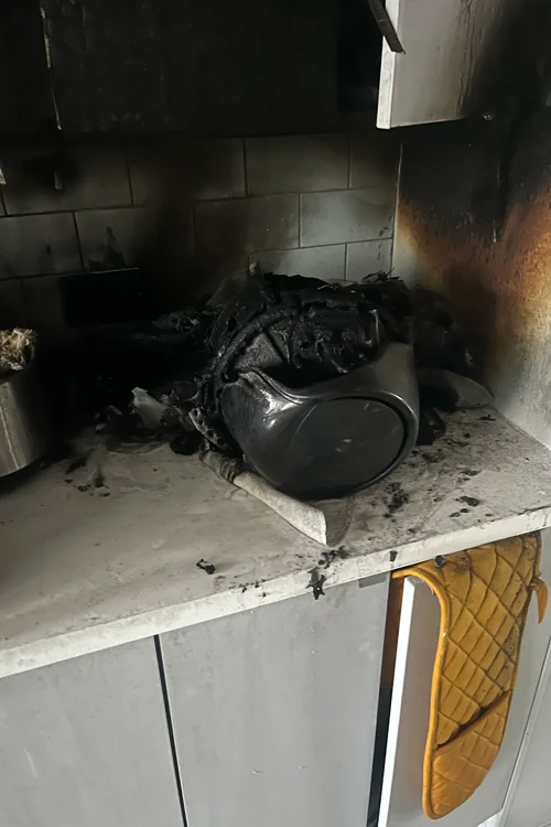 Melted air fryer from a fire on the kitchen side