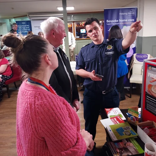 Fire service staff talking to the public at a fair