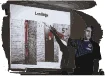 Firefighter giving a lesson in front of a projector screen