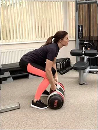 Demonstration of the down position for the clean and press exercise