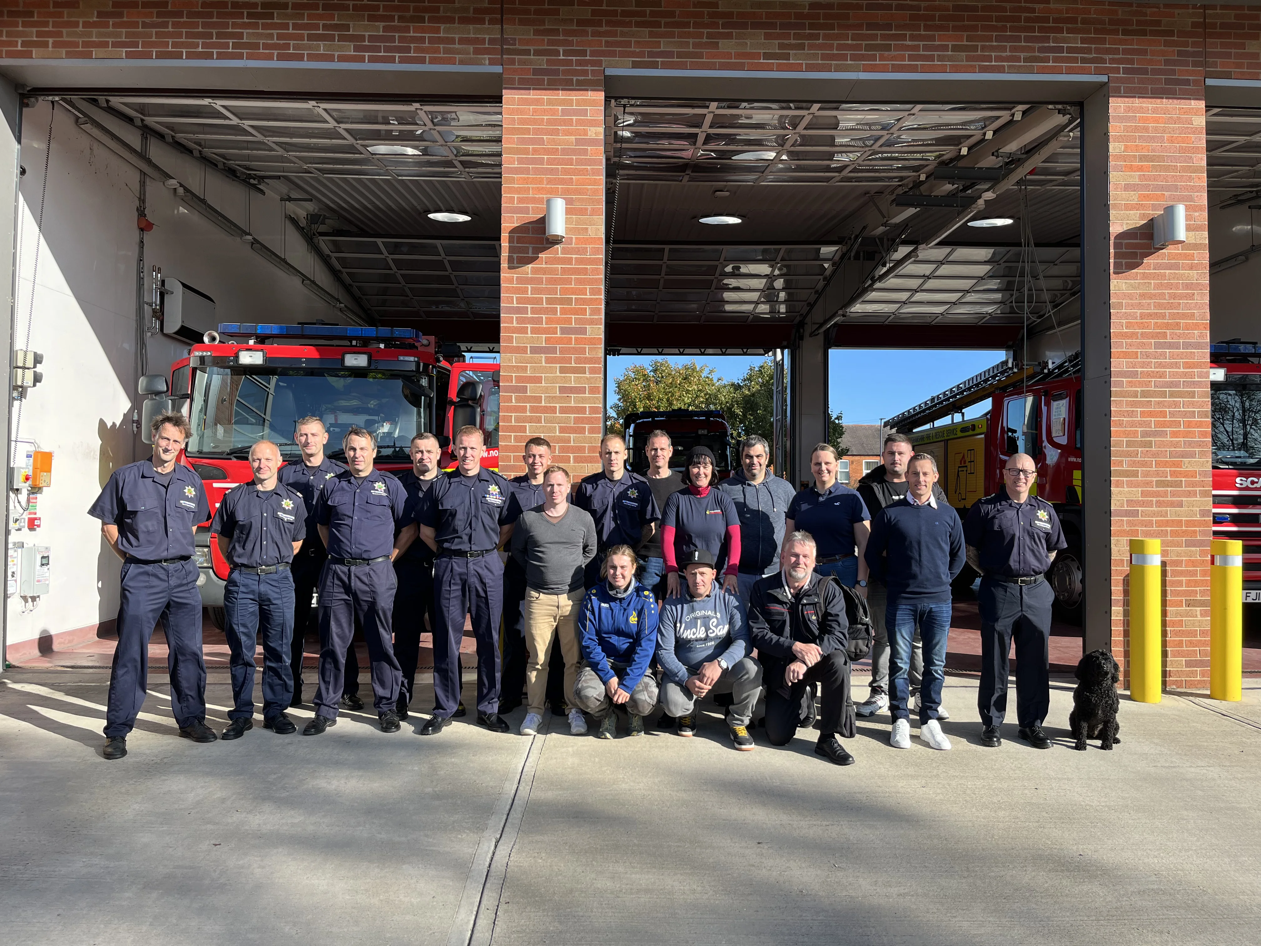 Group of firefighters from UK and Germany outside Newark Fire Station