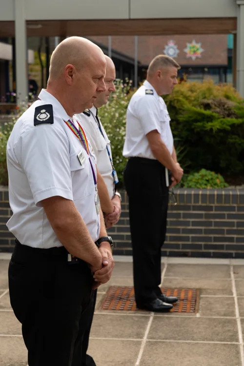 Officers taking part in a two minute silence (Left - Right) Assistant Chief Fire Officer Mick Sharman, Chief Constable Craig Guildford, Chief Fire Officer Craig Parkin
