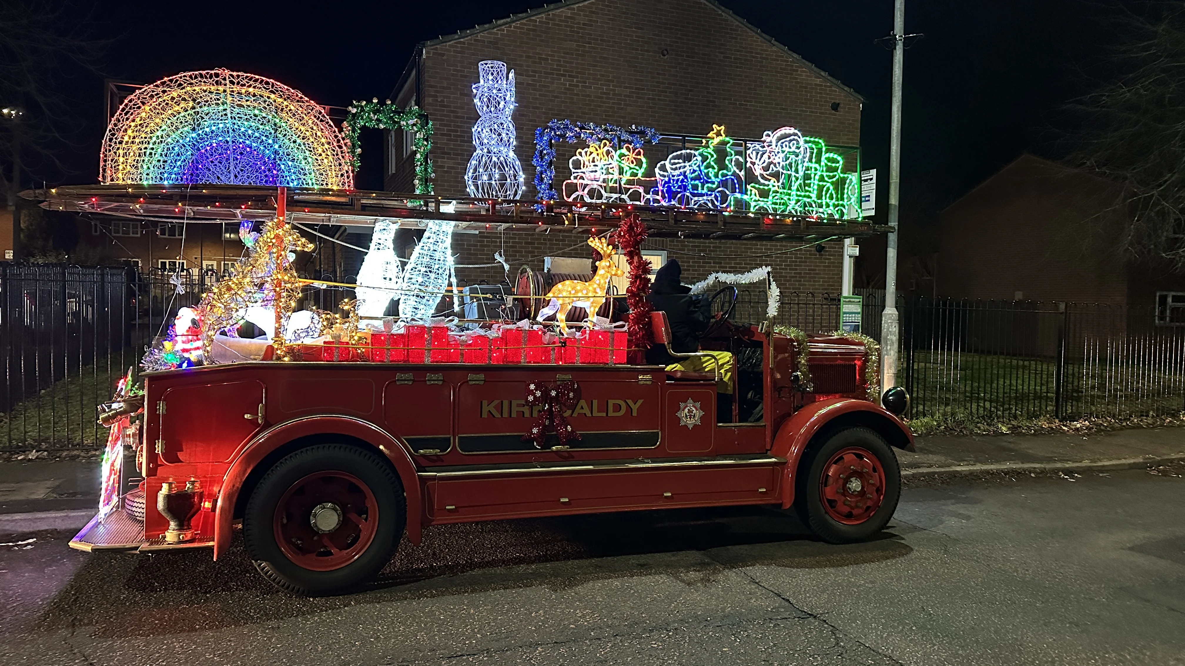 vintage fire engine with christmas lights, side view