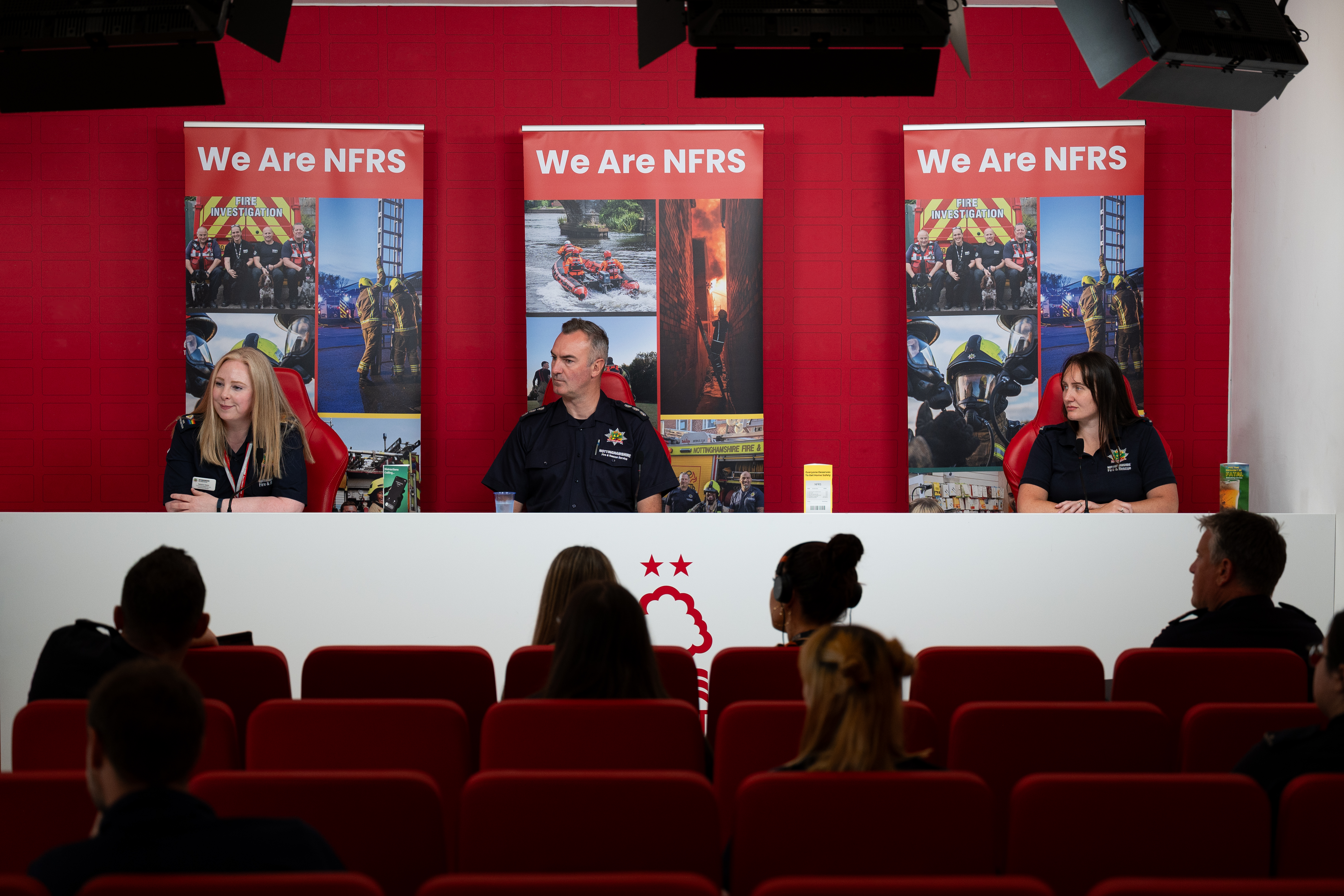 Three members of NFRS staff sat on the top table in the press conference room at Nottingham Forest 
