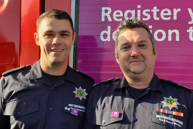 Gav and Kev pose with their NCA carer champion badges.