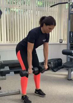 Demonstration of a bent over row with weights by the knees