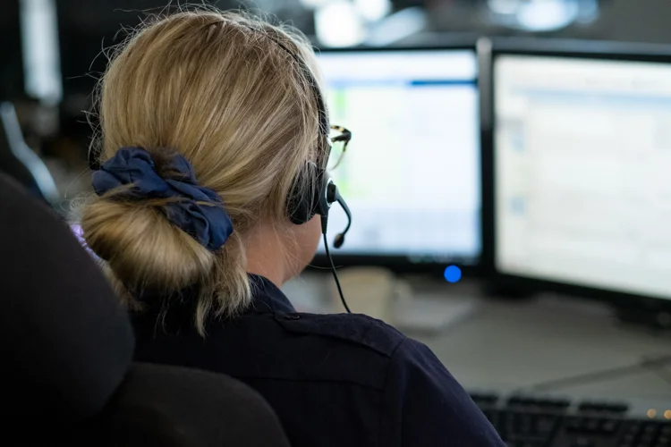 Fire control operator looking at computer screens.