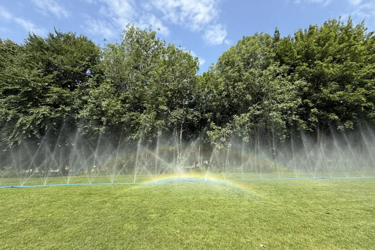 Blue HydroWall Hose spraying water