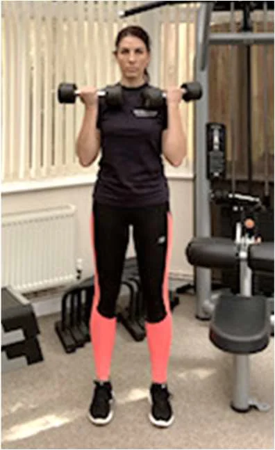 Bicep curl with weights raised to shoulder height