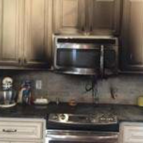 Cooker top with signs of smoke damage from previous fire