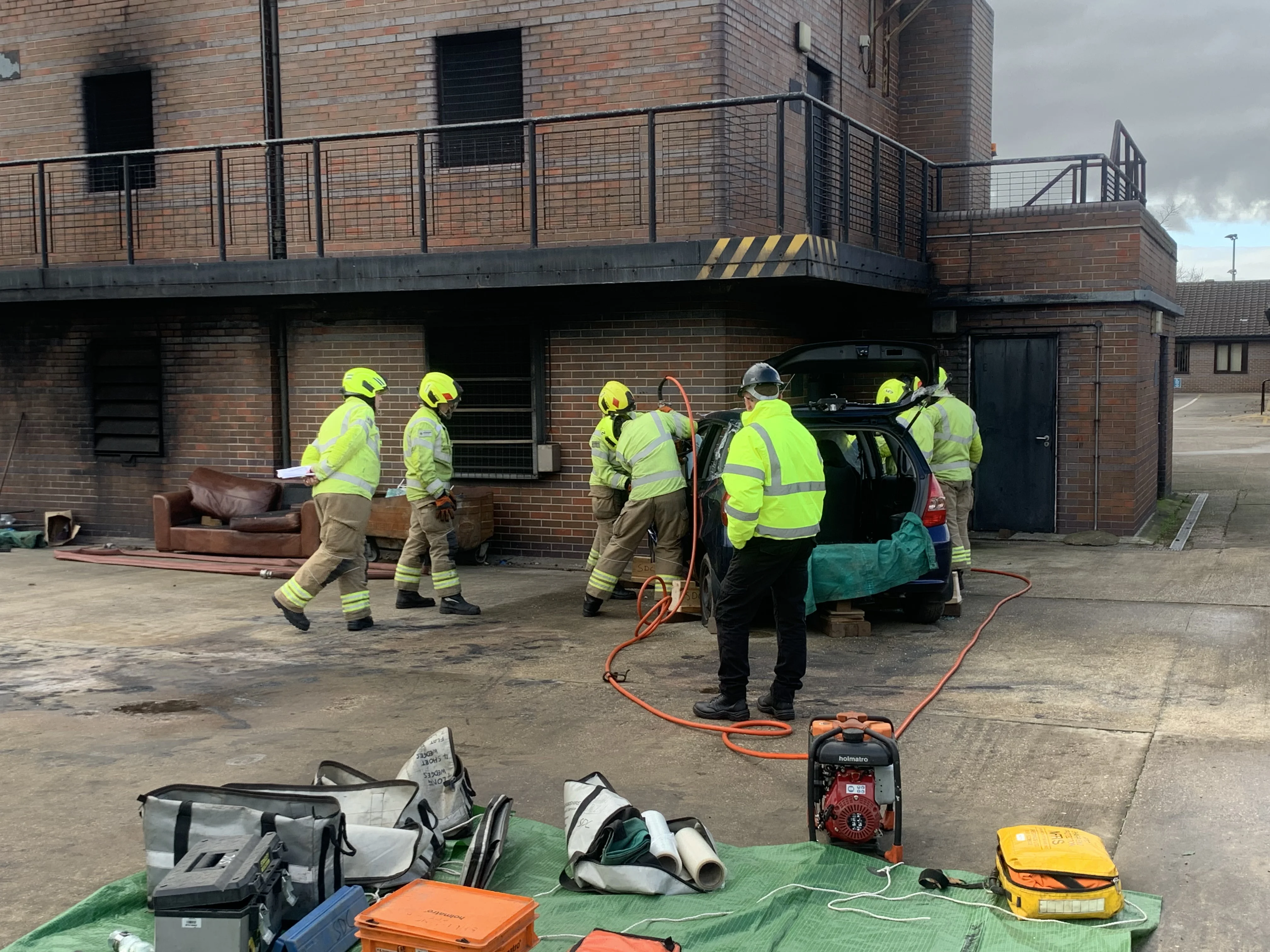 firefighters cutting a casualty out of a road traffic collision