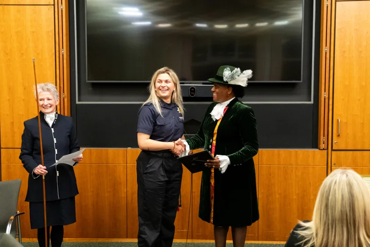 Sophie shaking the hand of the High Sheriff