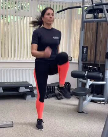 Demonstration of raising a knee parallel to the ground