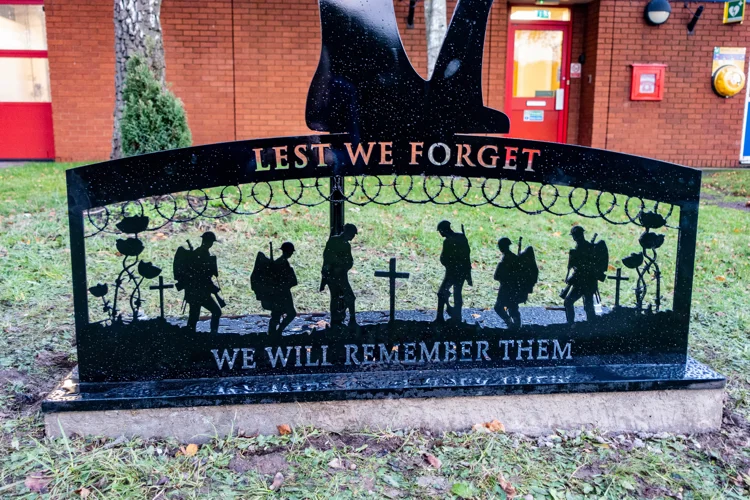 Close up of the bottom of the silhouette with "Lest we forget" and "We will remember them".