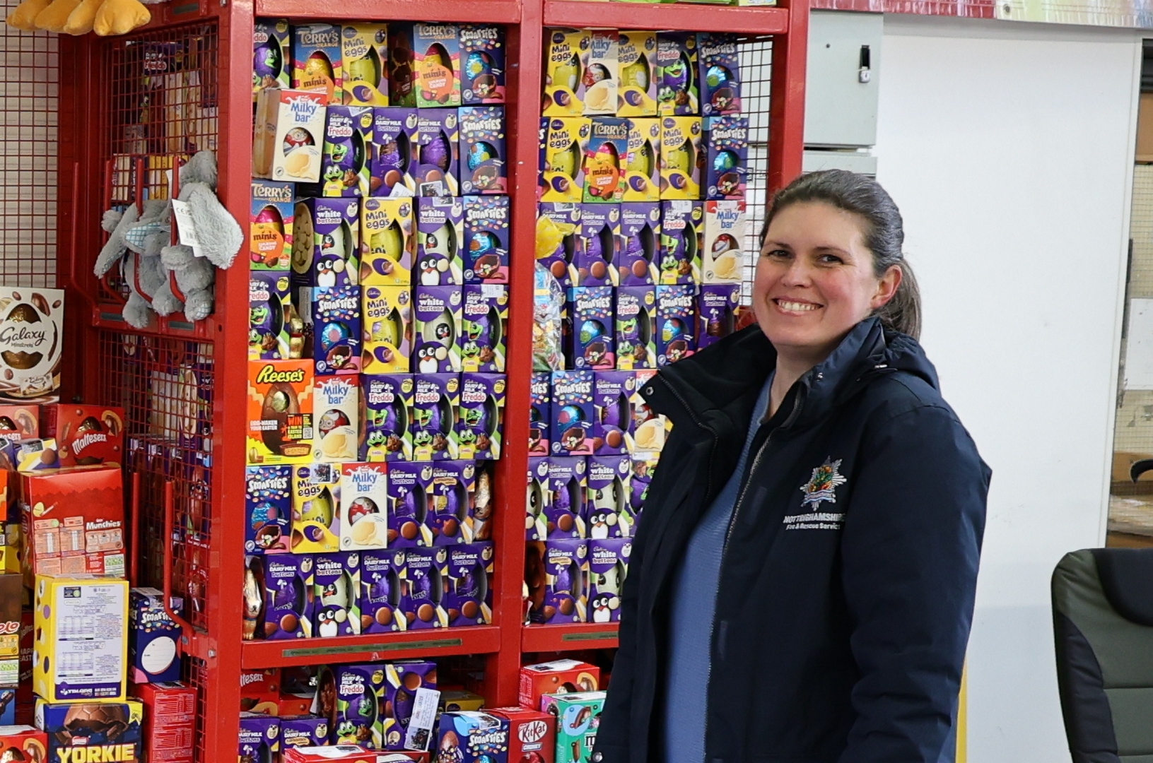 NFRS staff in front of Easter Eggs smiling 