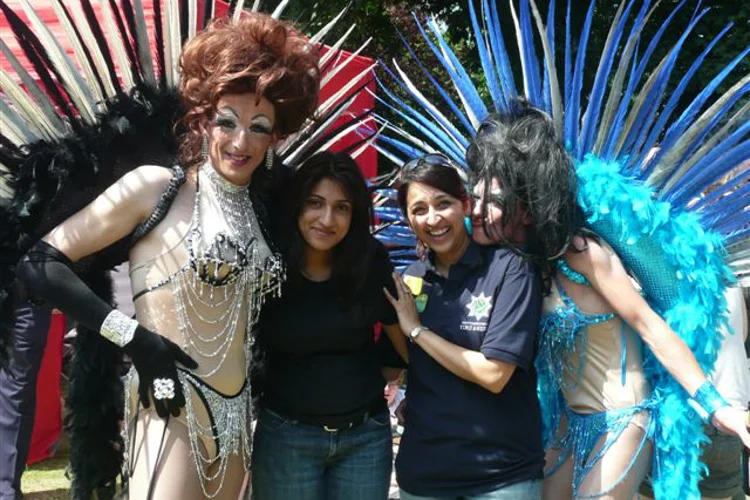 Nottinghamshire Fire and Rescue staff with a pair of drag queens during Nottingham Carnival.