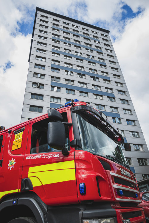 Fire engine parked outside a multi-storey building