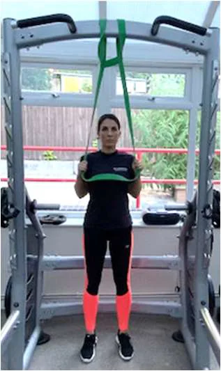 Lat pull down using exercise bands, arms pulled down to shoulder height