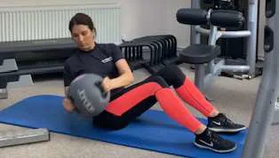 An oblique twists with a medicine ball