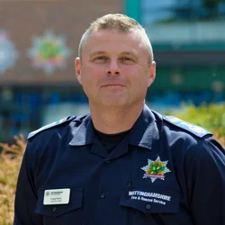 Craig Parkin in his blue uniform as Chief Fire Officer