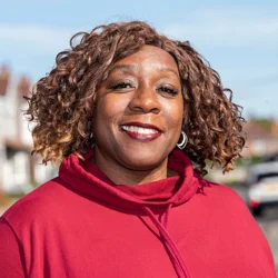 Cllr Audra Wynter wearing a red jumper