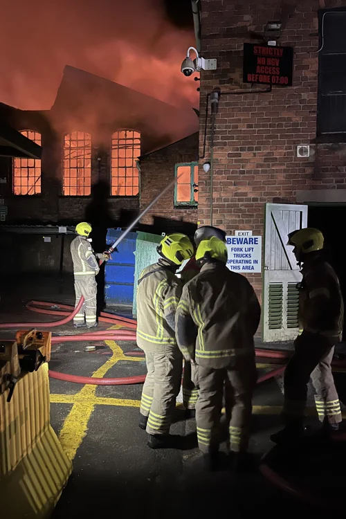 Firefighters preventing the spread of the fire on Forest Road Mansfield