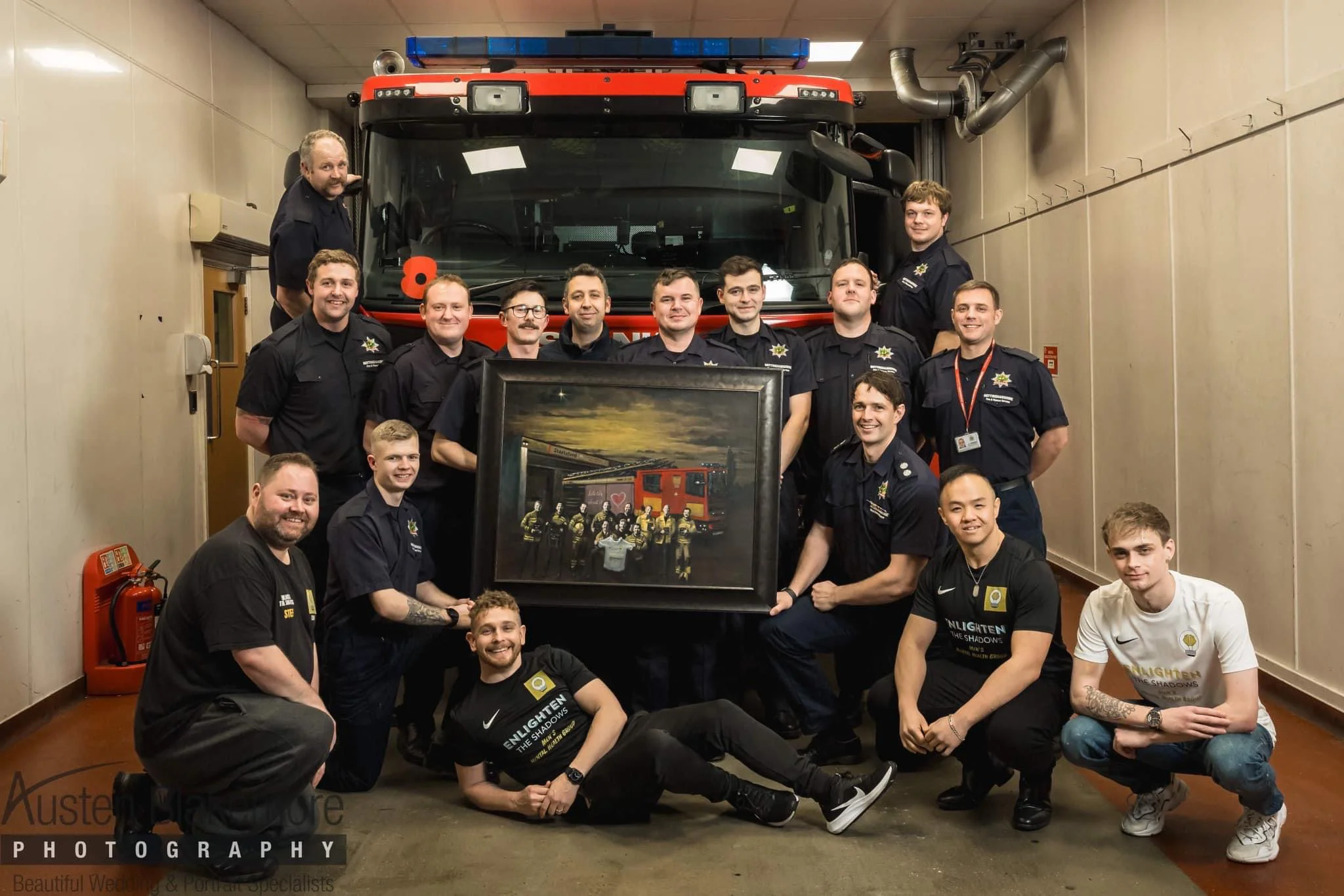 Stapleford crews and Enlighten the Shadows members with the painting by the fire engine.