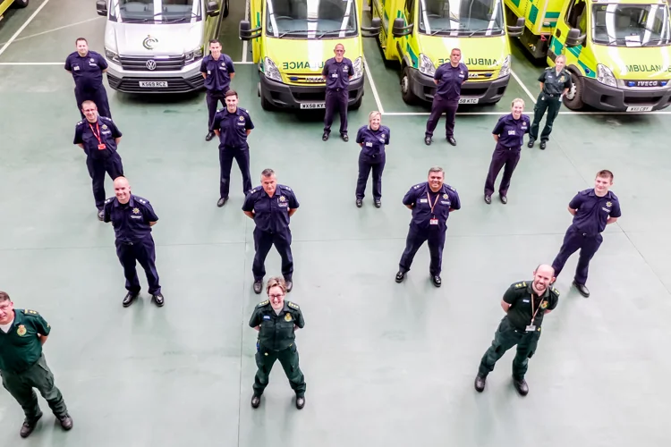 Group photos of firefighters with trainers East Midlands Ambulance Service