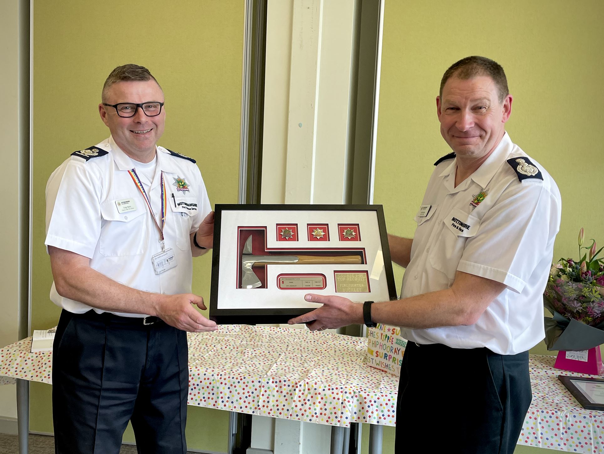 Craig Parkin presenting a plaque to Chief Fire Officer John Buckley