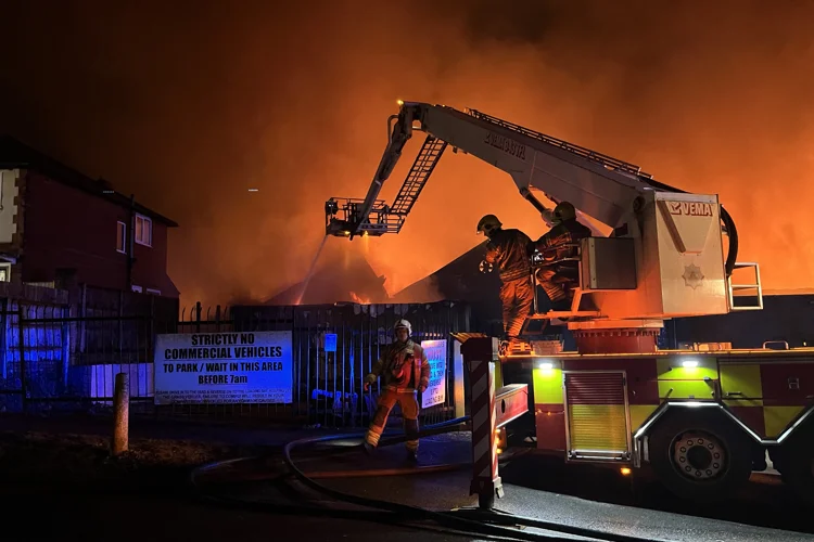 Aerial Ladder Platform spraying water on the fire on Forest Road Mansfield