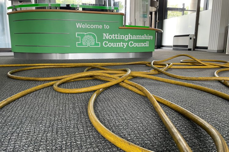 Reception of Nottinghamshire County Hall with the floor covered in firefighter hoses