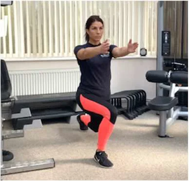 A women performing a lunge with both arms extended forward