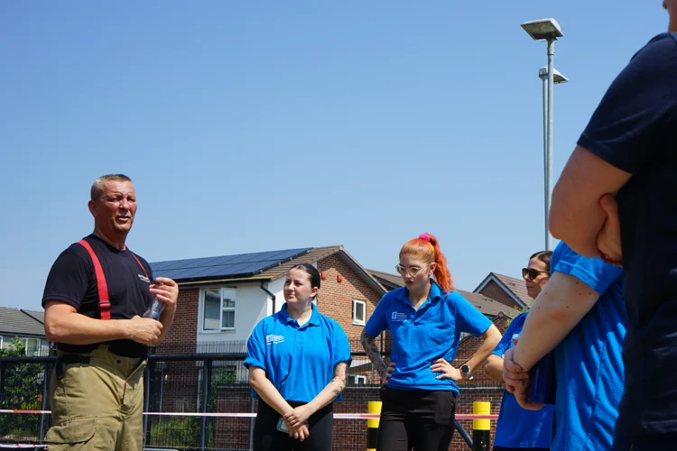 A firefighter speaks to students.