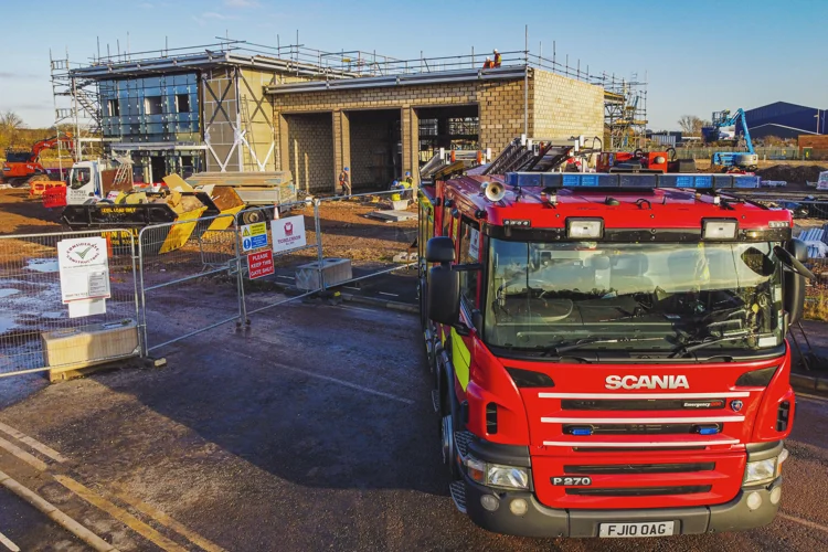 Fire engine in front of the new partially constructed Worksop fire station.