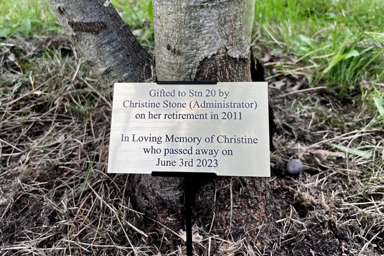 Plaque to Christine Stone which reads: "Gifted to Station 20 by Christine Stone on her retirement in 2011. In loving memory of Christine who passed away on June 3 2023."