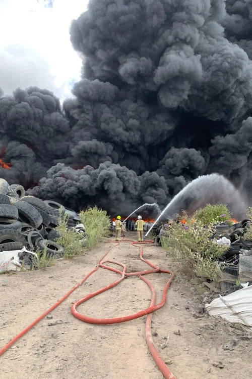 A pair of firefighters tackling the fire on an industrial site in Ranskill